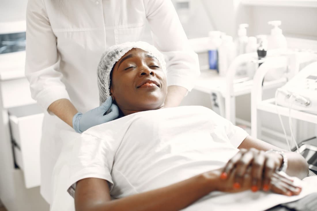 A client relaxing during a facial treatment